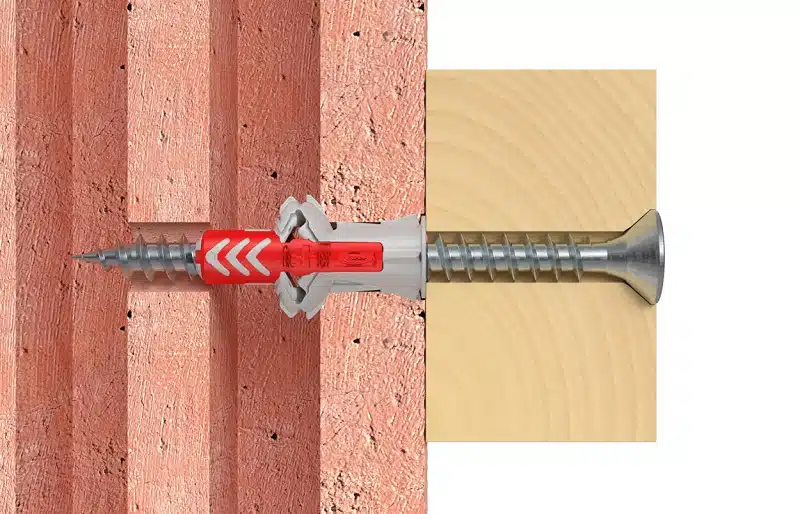 Comment fixer des charges lourdes au mur avec des chevilles pour parpaing creux